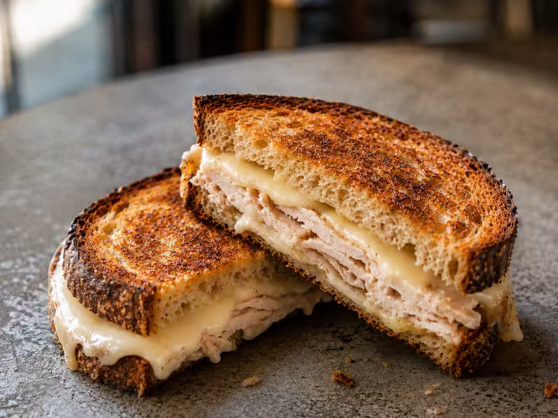 A turkey and swiss sandwich on toasted sourdough